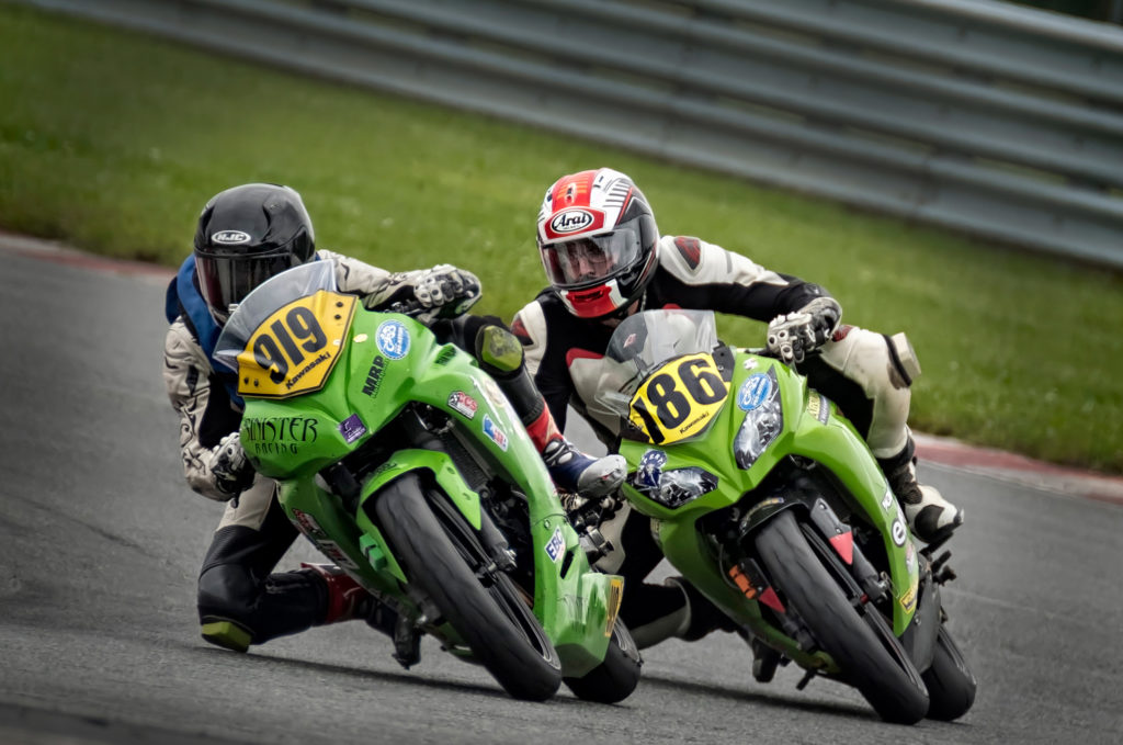 Kawasaki motorcycles duel during MotoAmerica Championship event at NJMP