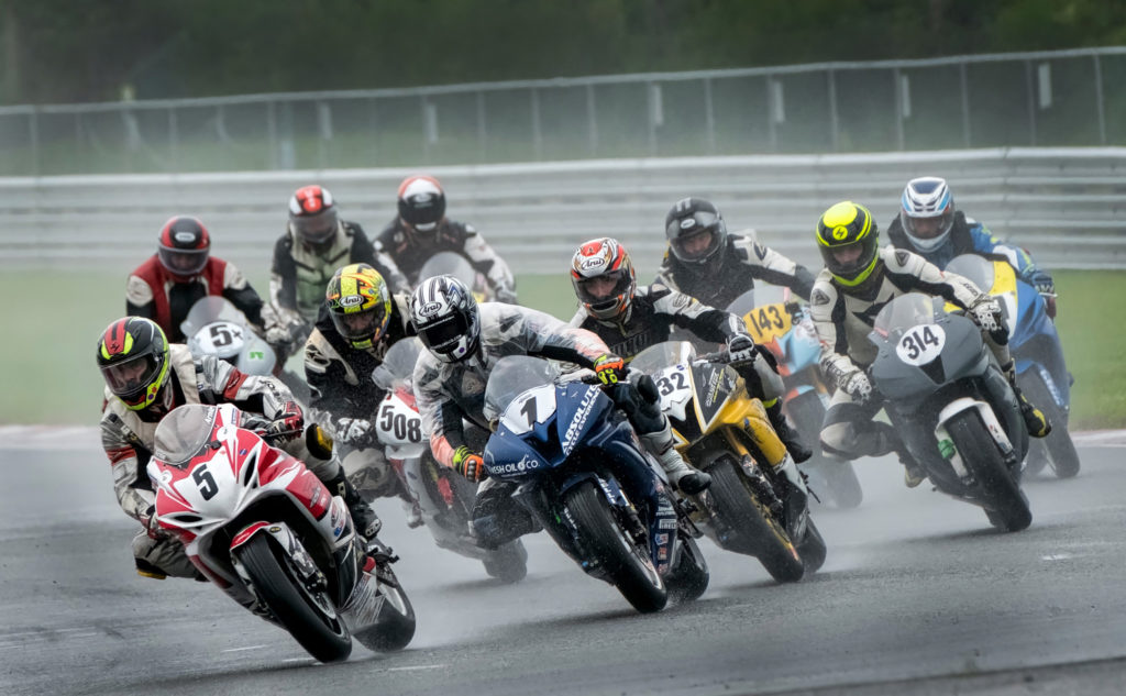 motorcycles racing in the rain professional photographic images pictures pics