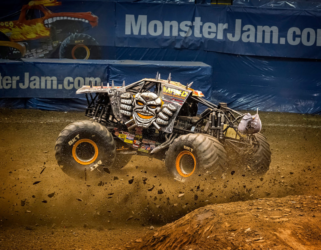 photographing a monster jam event indoors